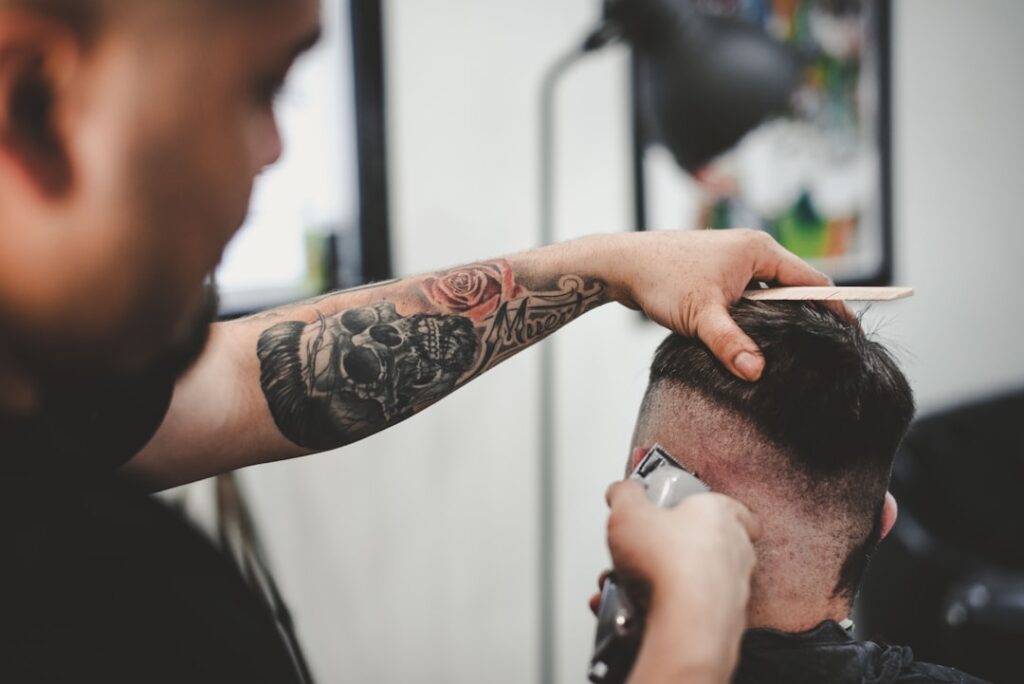 man cutting hair of man with hair loss