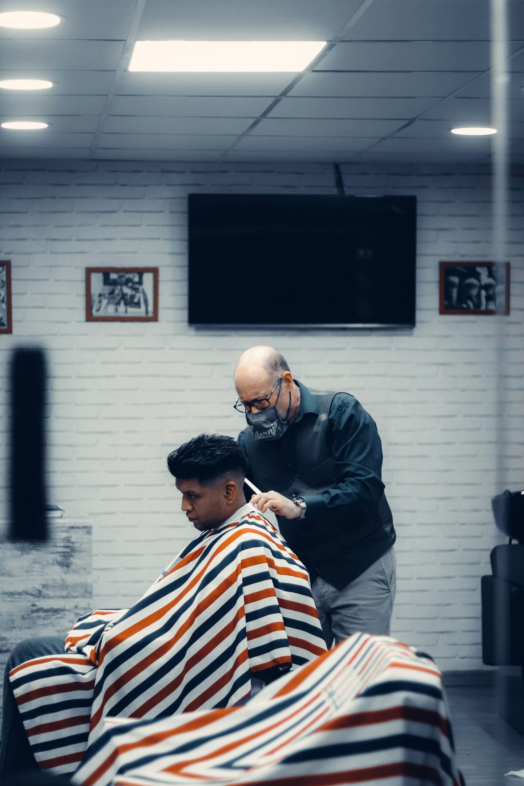 hair system specialist discussing base type with client